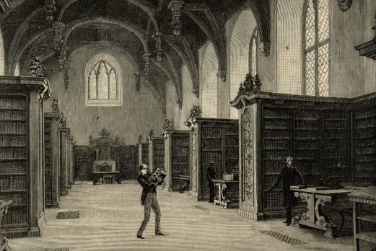 Librarian carrying tottering pile of books in the Great Hall, Lambeth Palace Library