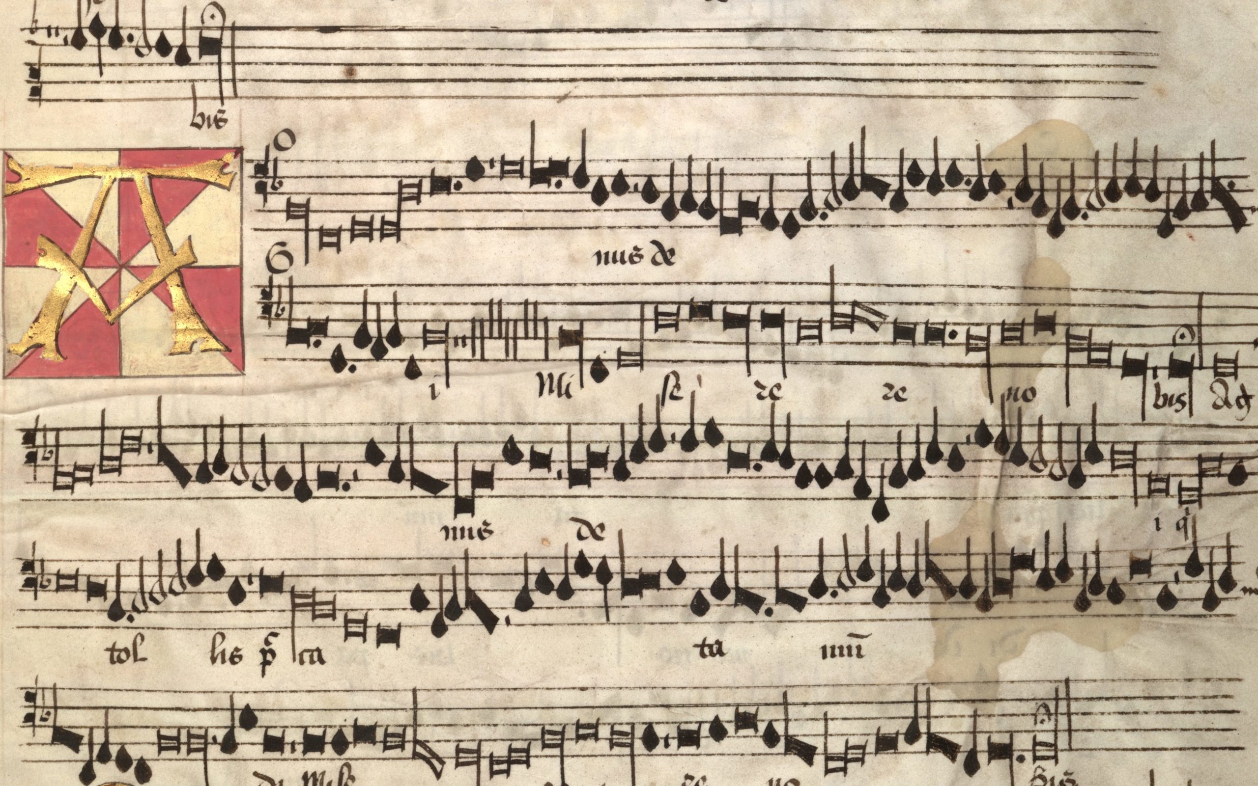 Detail from the Arundel Choirbook showing a decorated leeter A and some lines of music