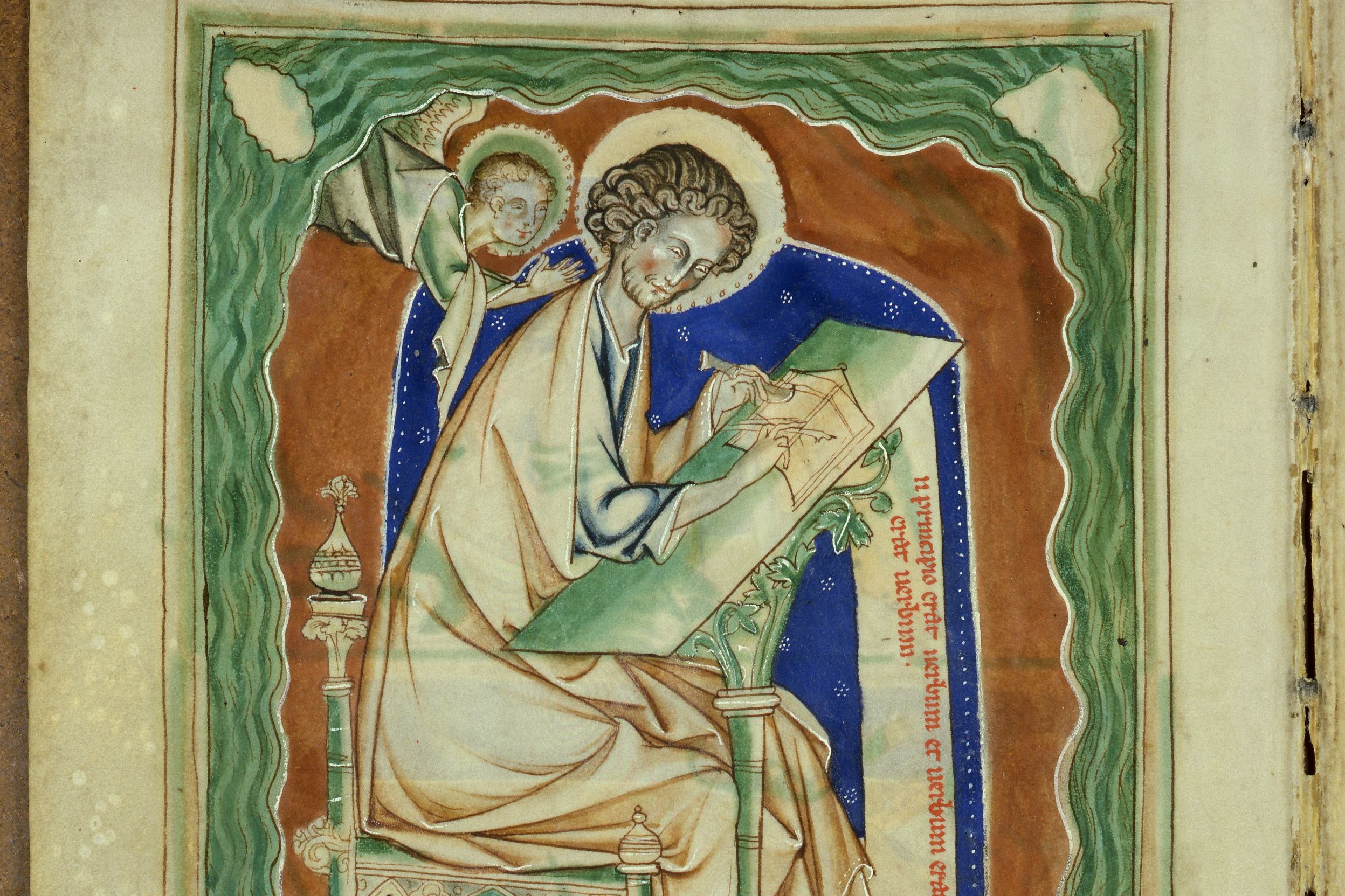 Saint John writing Revelation