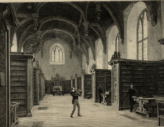 Lambeth Palace Library in the Great Hall as depicted in the Graphic 1886. The librarian watches as a boy struggles with a pile of books.